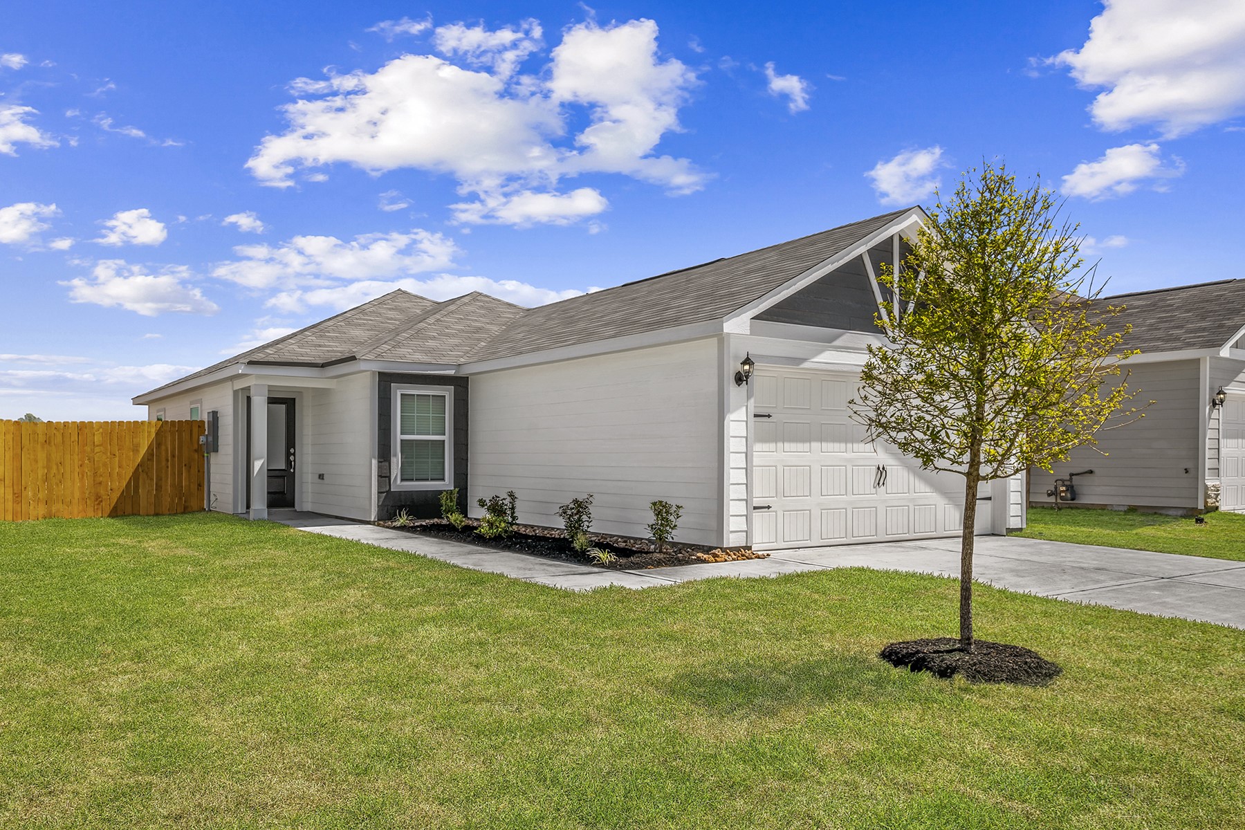 10410 Red Cardinal Drive Cleveland, TX 77328 - Photo 11 of 11 a house view with a garden space