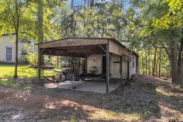 a view of a small house with a yard