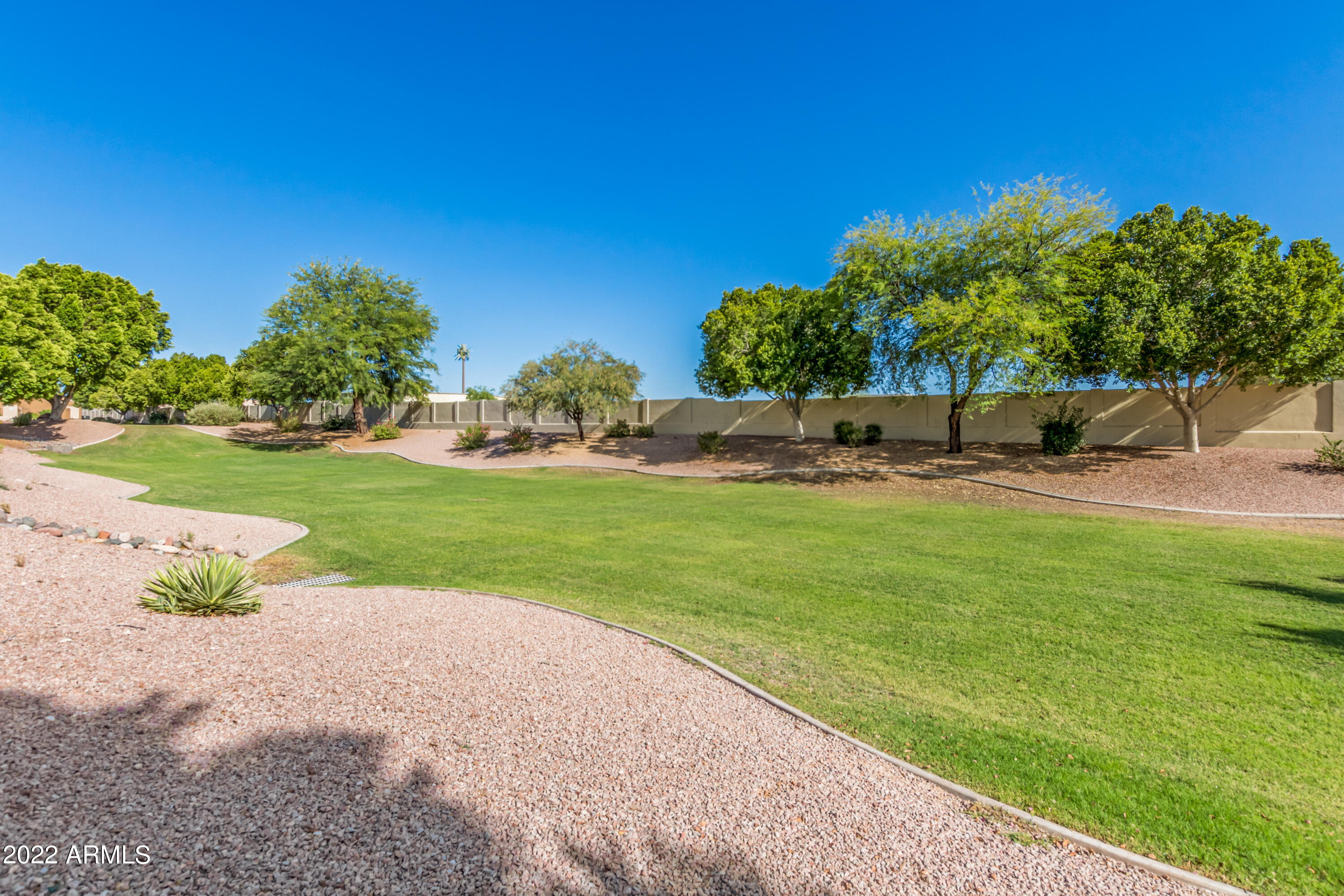 5830 East McKellips Road, Unit 76 Mesa, AZ 85215 - Photo 27 of 33 a view of a park with plants and trees