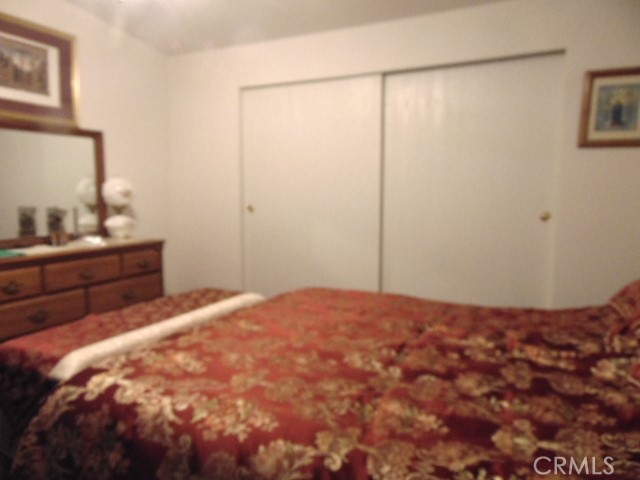 3835 Gardiner Ferry Road, Unit 62 Corning, CA 96021 - Photo 26 of 34 a bedroom with a bed and a dresser
