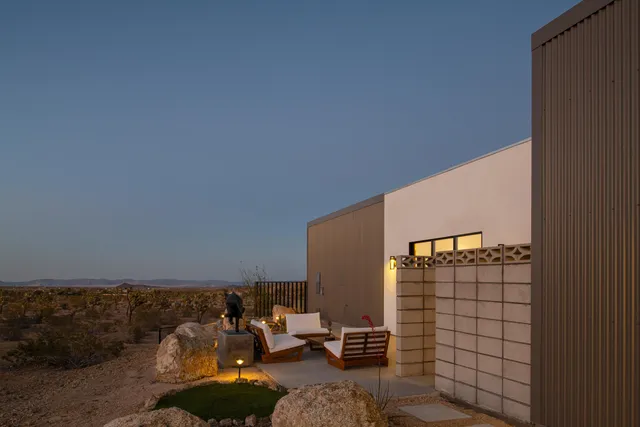 a backyard of a house with seating space