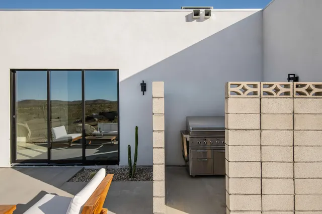 a kitchen with a refrigerator and a stove top oven