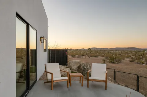 a view of a chairs and table in terrace