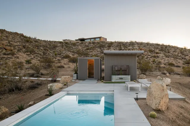a view of a mountain with the back yard