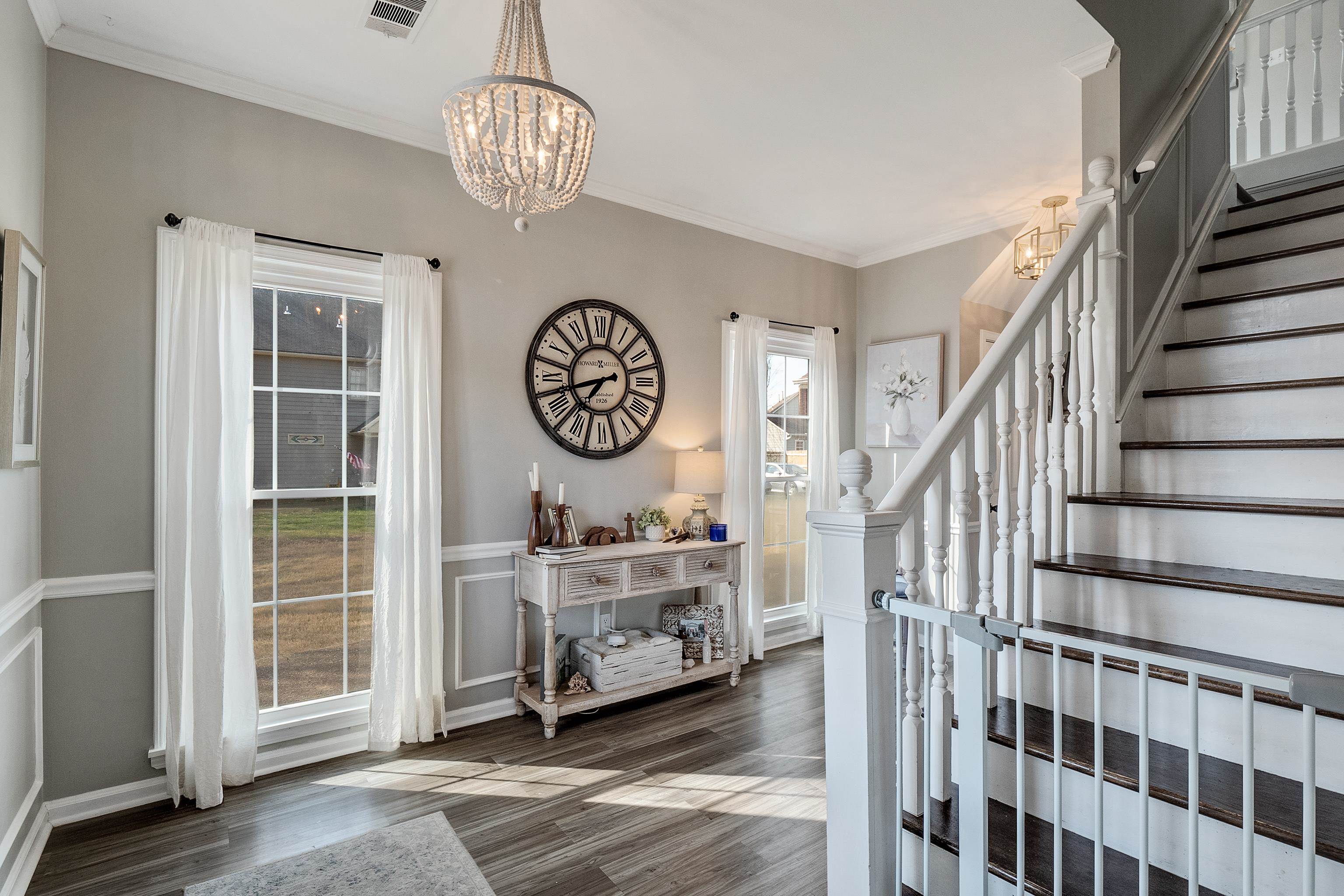 867 South Collierville Arlington Road Collierville, TN 38017 - Photo 12 of 35 Staircase with hardwood / wood-style floors, ornamental molding, and a chandelier
