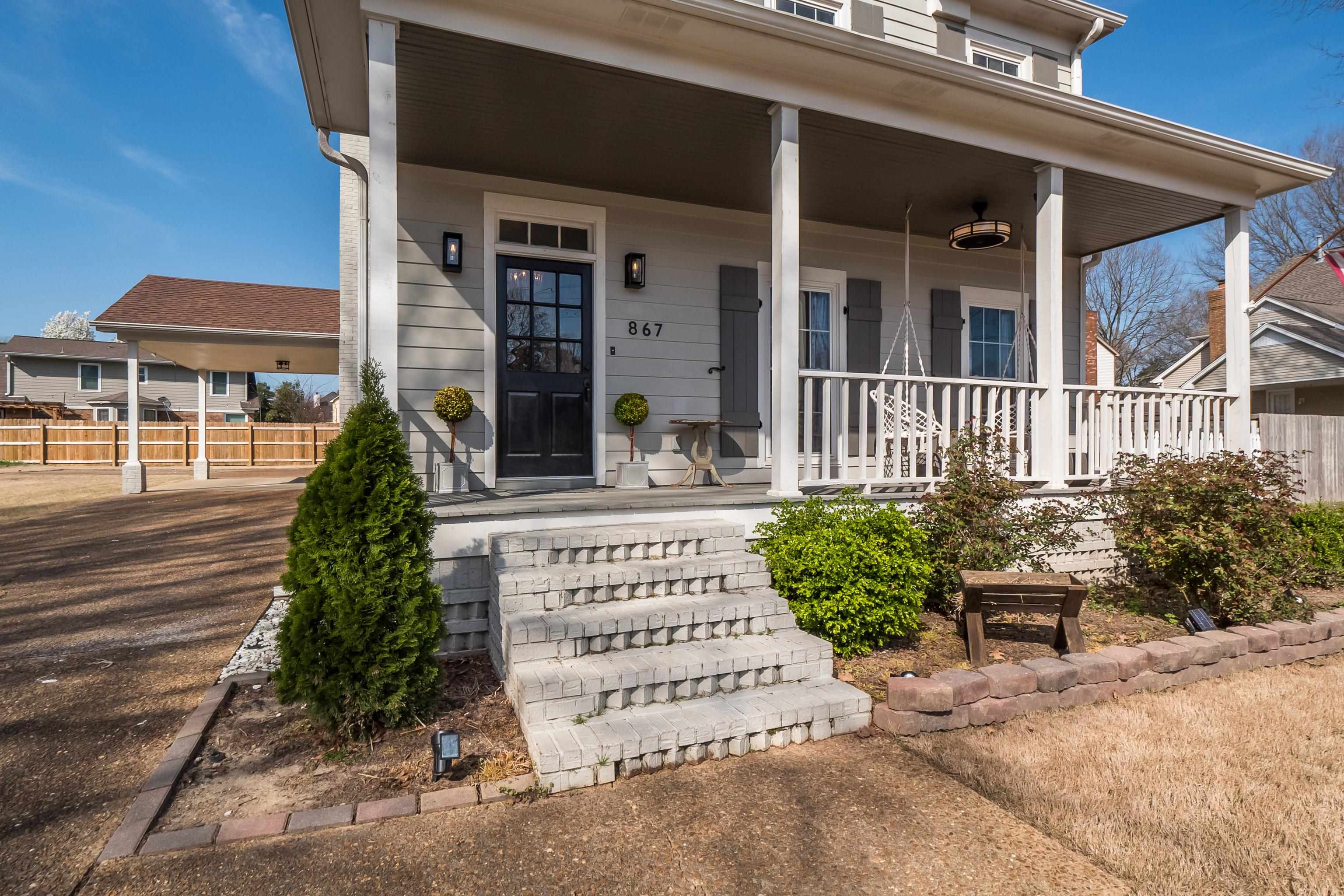 Property entrance featuring covered porch