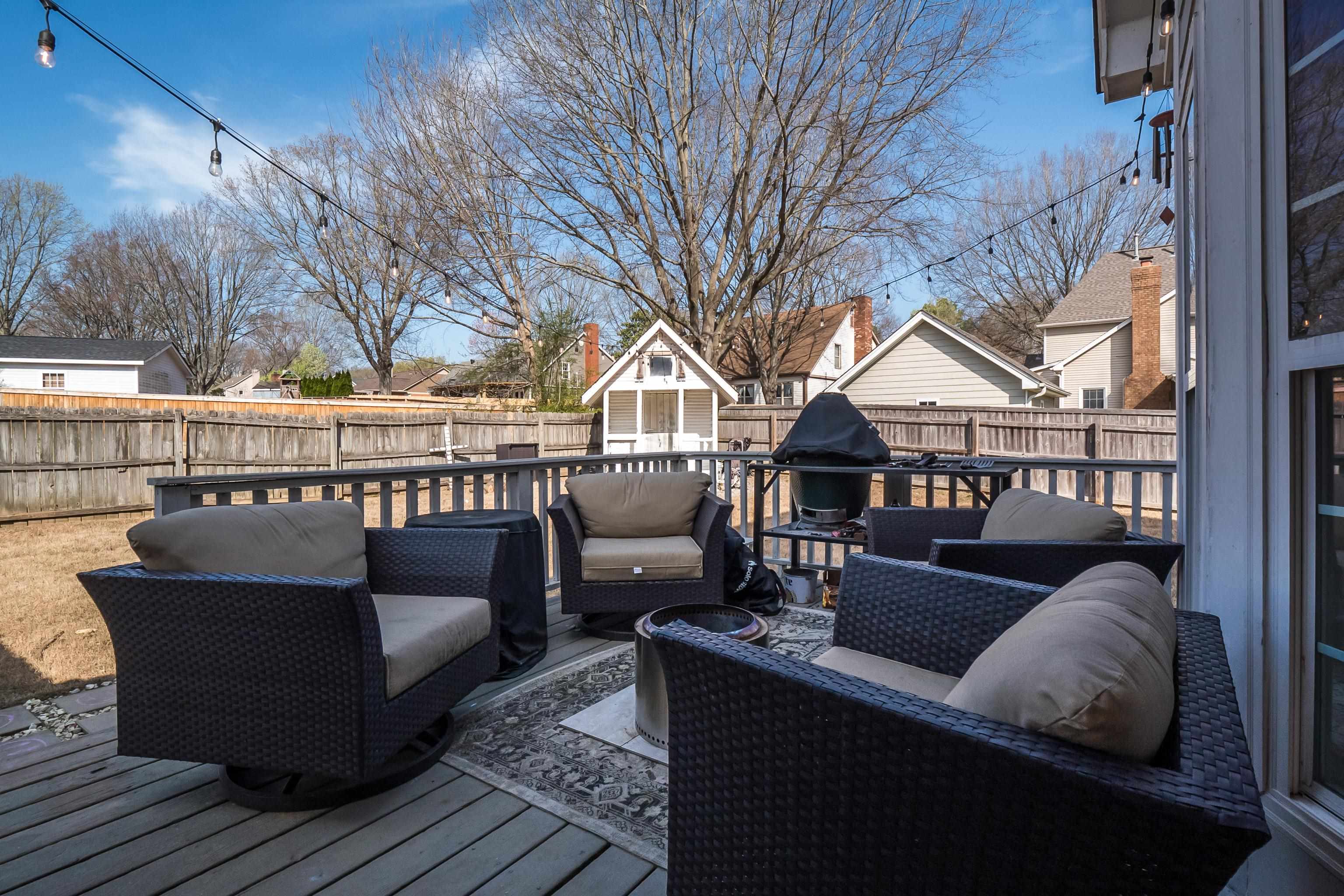 Deck with a separate heated/cooled log cabin and an outdoor hangout area