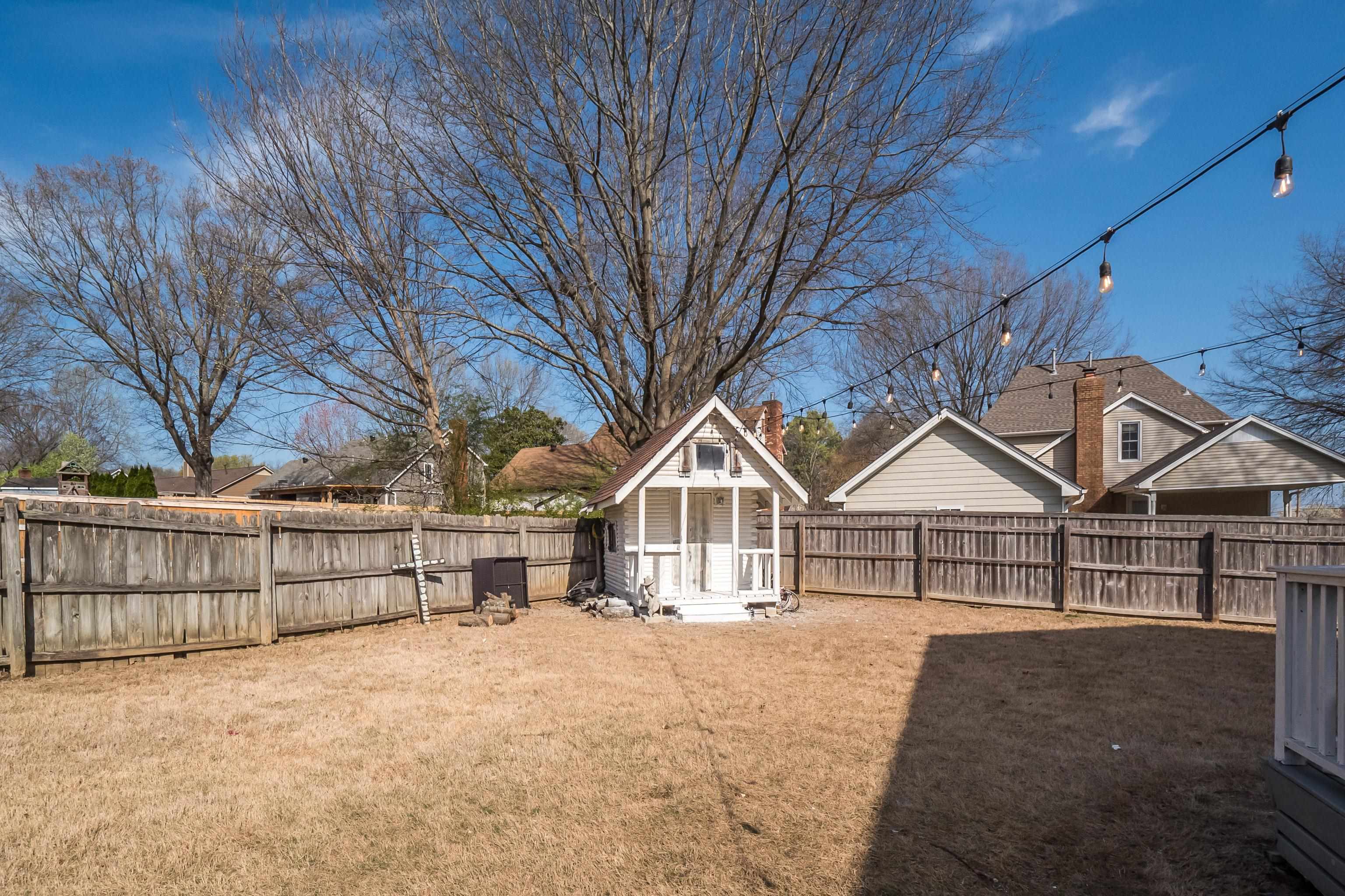 View of yard featuring a heated and cooled log cabin