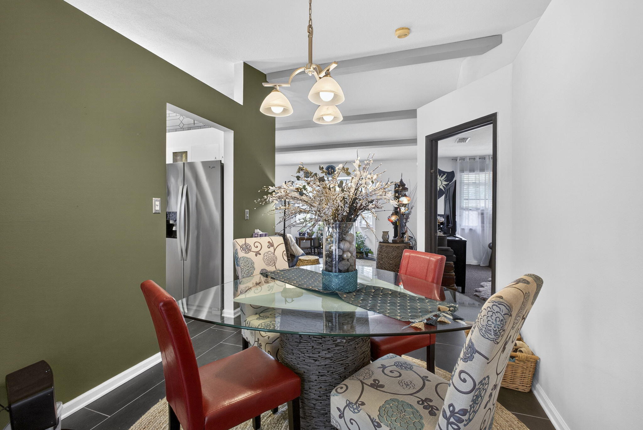 15773 85th Road North Loxahatchee, FL 33470 - Photo 15 of 75 a view of a dining room with furniture and a chandelier