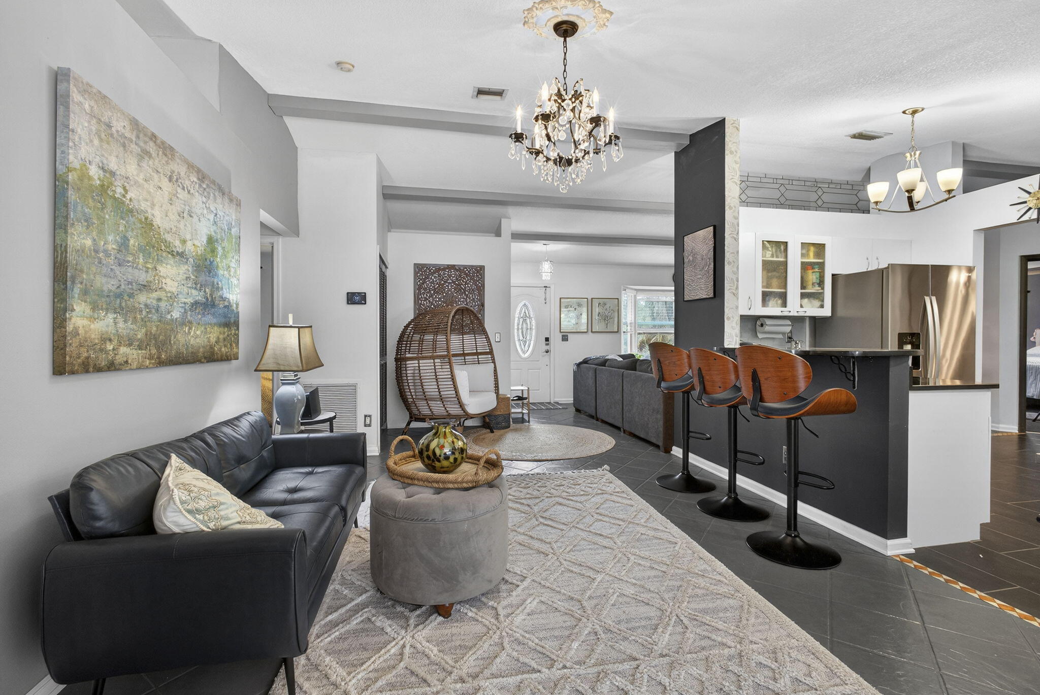 15773 85th Road North Loxahatchee, FL 33470 - Photo 19 of 75 a living room with furniture a chandelier and a dining table