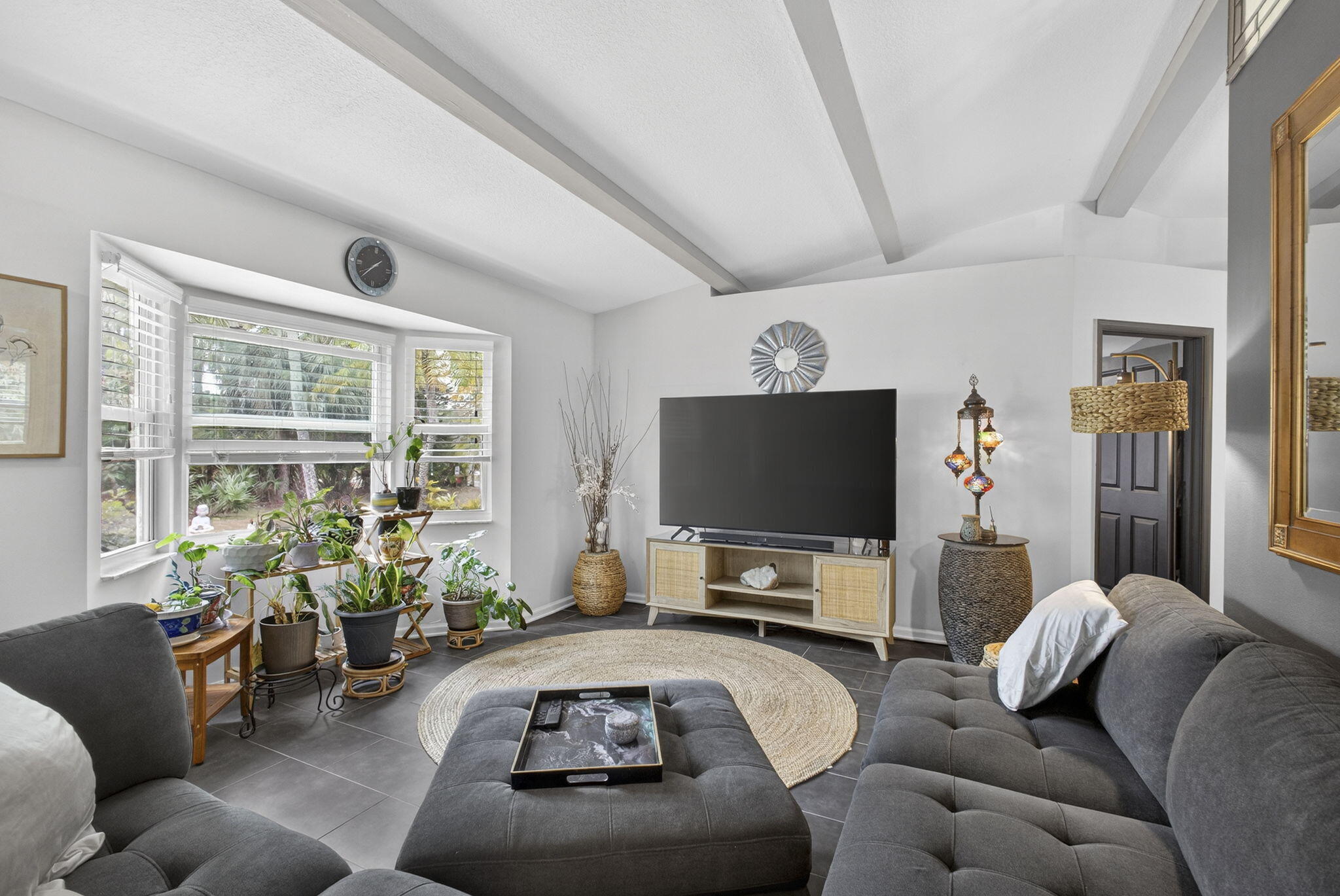 15773 85th Road North Loxahatchee, FL 33470 - Photo 2 of 75 a living room with furniture and a flat screen tv