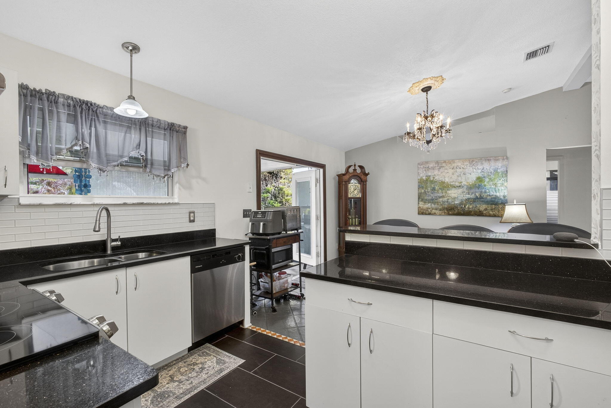 15773 85th Road North Loxahatchee, FL 33470 - Photo 25 of 75 a kitchen with granite countertop a sink and cabinets