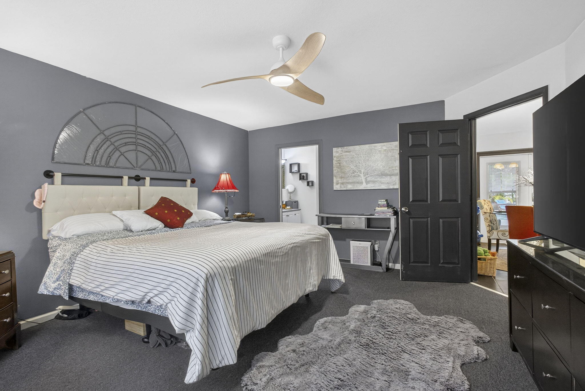 15773 85th Road North Loxahatchee, FL 33470 - Photo 28 of 75 a bedroom with bed and wooden floor