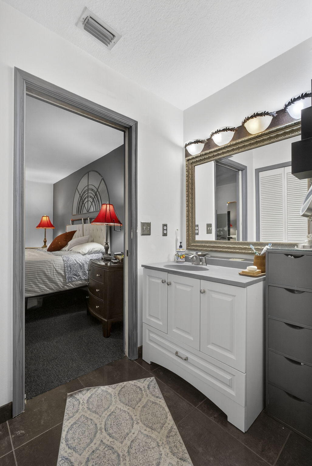 15773 85th Road North Loxahatchee, FL 33470 - Photo 29 of 75 a en suite bathroom with a double vanity sink and a mirror