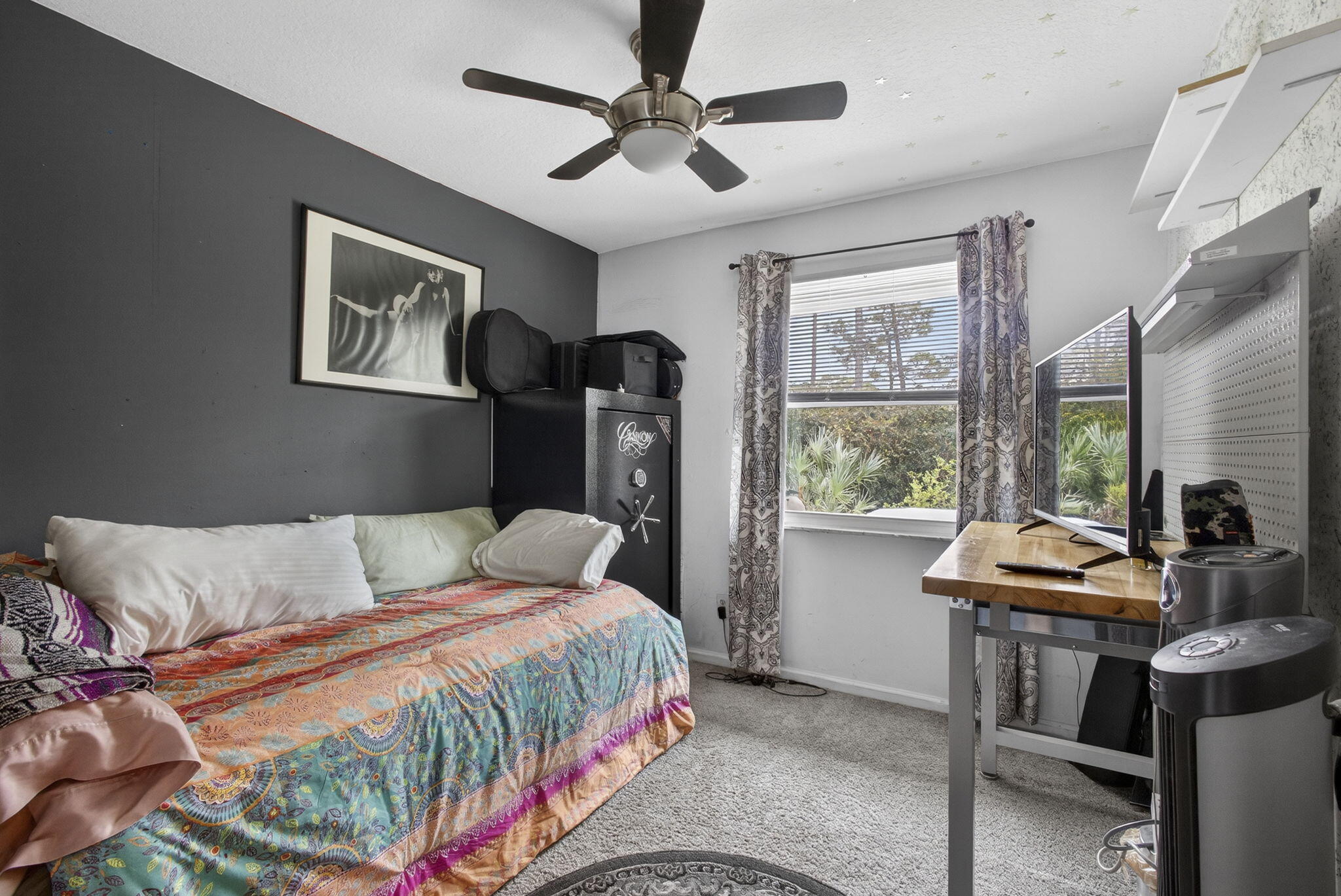 15773 85th Road North Loxahatchee, FL 33470 - Photo 32 of 75 a bedroom with a bed and a flat screen tv