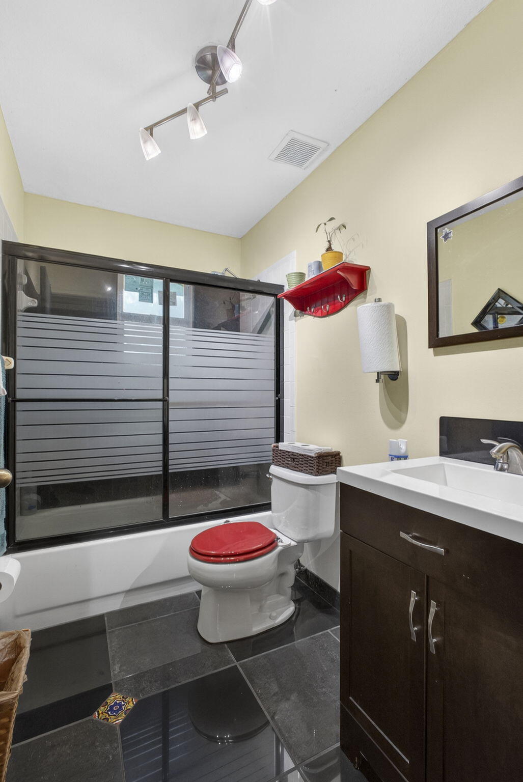 15773 85th Road North Loxahatchee, FL 33470 - Photo 35 of 75 a bathroom with a toilet sink and mirror