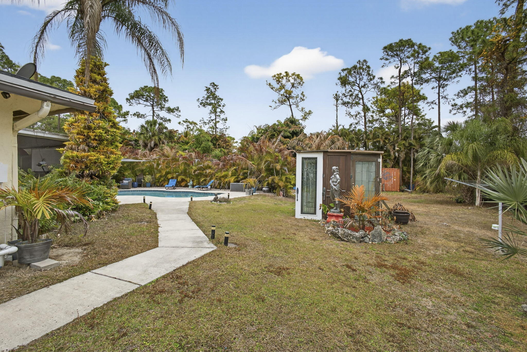 15773 85th Road North Loxahatchee, FL 33470 - Photo 52 of 75 a view of a house with backyard and sitting area