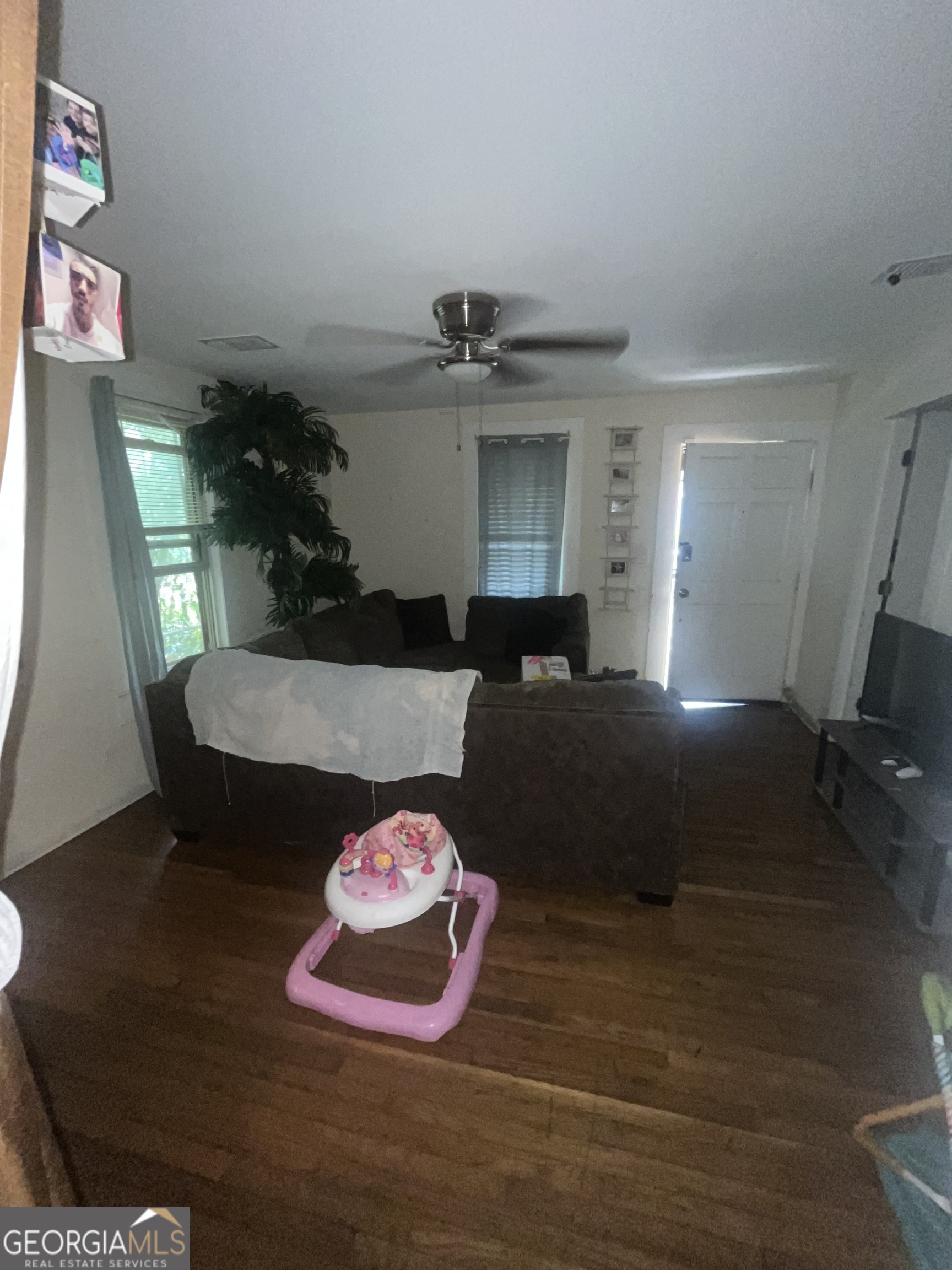 1621 Lee Street Brunswick, GA 31520 - Photo 12 of 14 a living room with furniture and a table