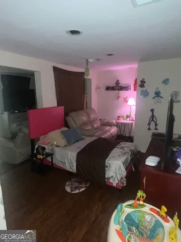 a bedroom with bed and a window