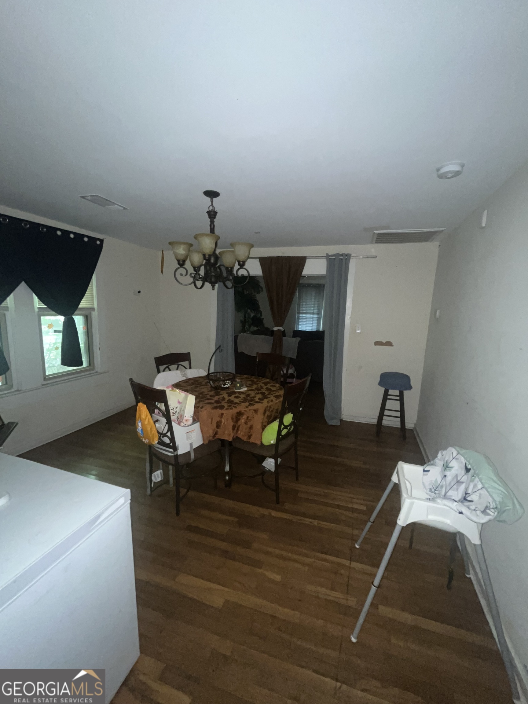 1621 Lee Street Brunswick, GA 31520 - Photo 10 of 14 a view of a dining room with furniture and wooden floor