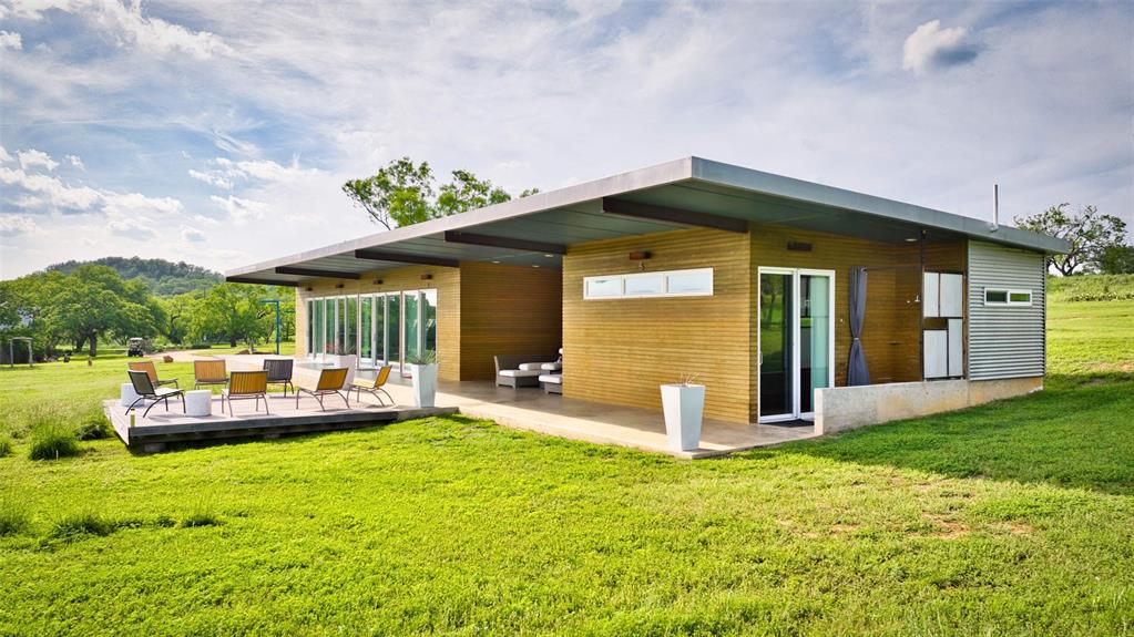 2969 County Lane Talpa, TX 76882 - Photo 28 of 40 Modern single-story residence featuring a flat roofline and extensive outdoor living spaces