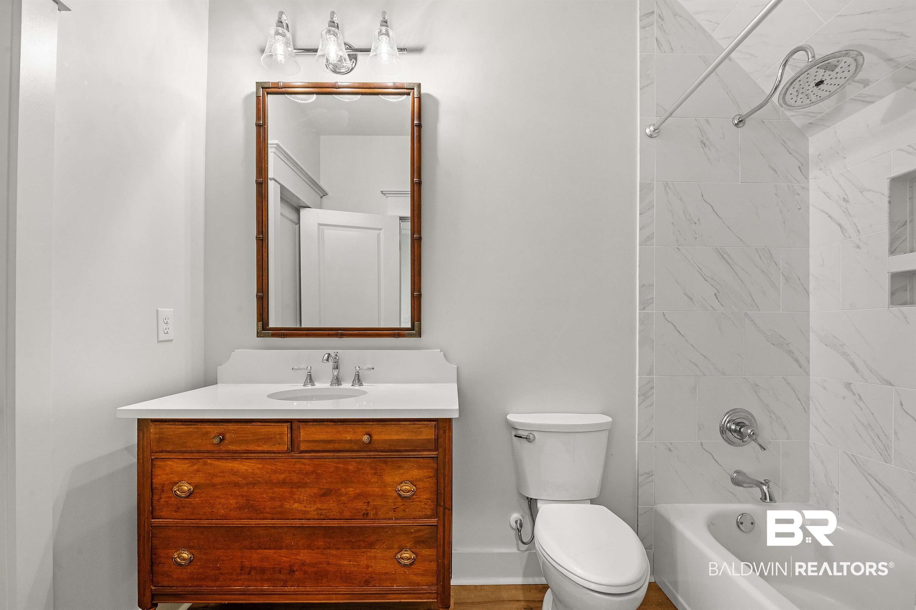27888 Oakachoy Loop Daphne, AL 36526 - Photo 47 of 65 Bathroom with baseboards, toilet, shower / bath combination, and vanity