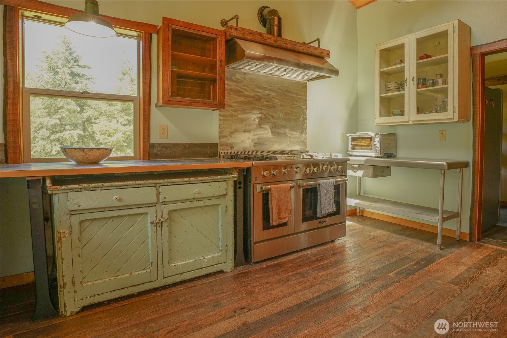 2904 Wildwood Road Quilcene, WA 98376 - Photo 6 of 39 a kitchen with stainless steel appliances granite countertop a stove and a sink