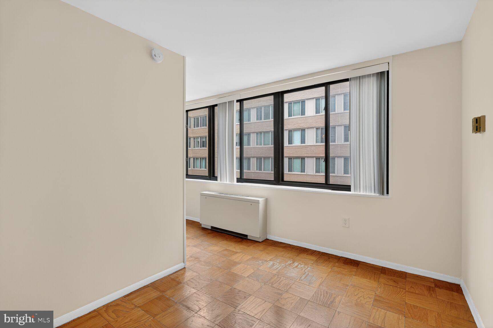 2030 F Street Northwest, Unit 411 Washington, DC 20006 - Photo 14 of 20 a view of an empty room with a window