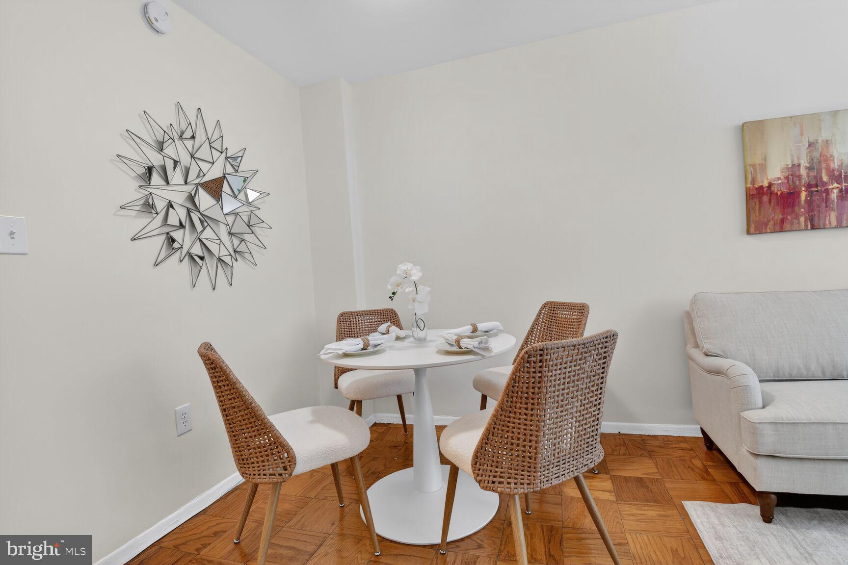 2030 F Street Northwest, Unit 411 Washington, DC 20006 - Photo 15 of 22 a view of a dining room with furniture and wooden floor