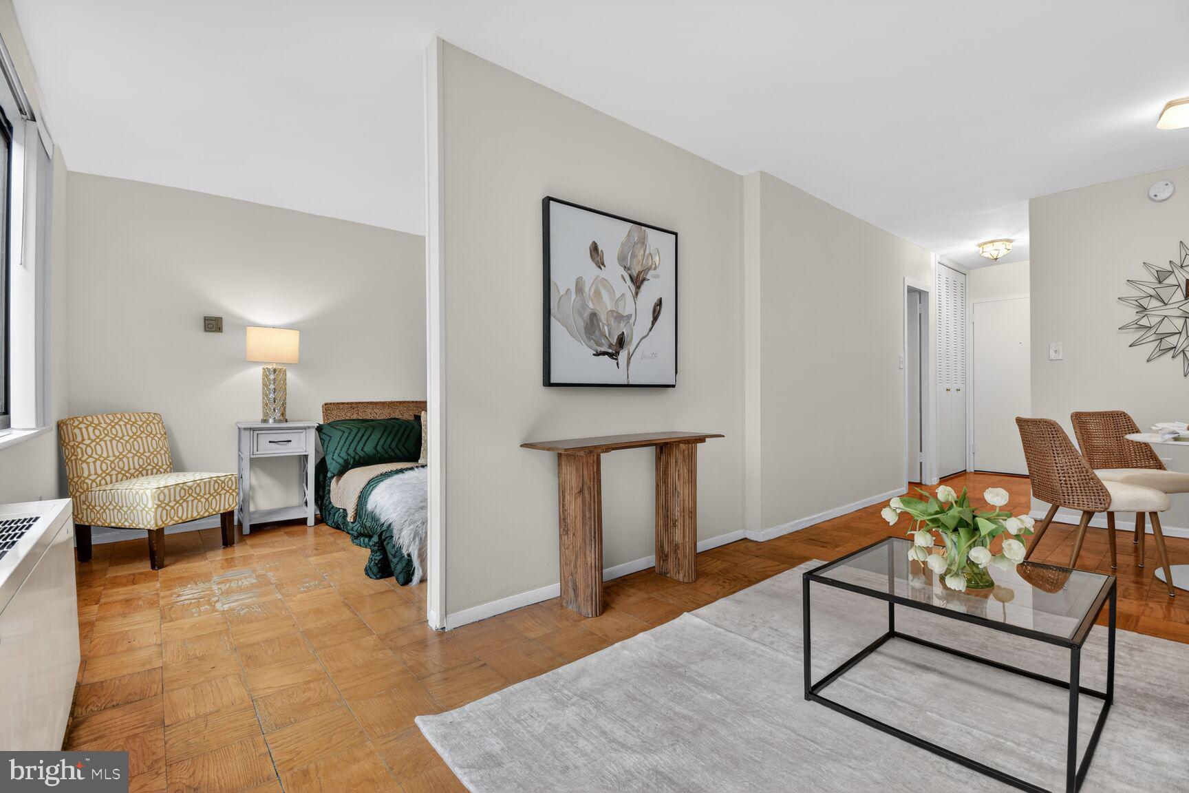 2030 F Street Northwest, Unit 411 Washington, DC 20006 - Photo 17 of 22 a living room with furniture and wooden floor