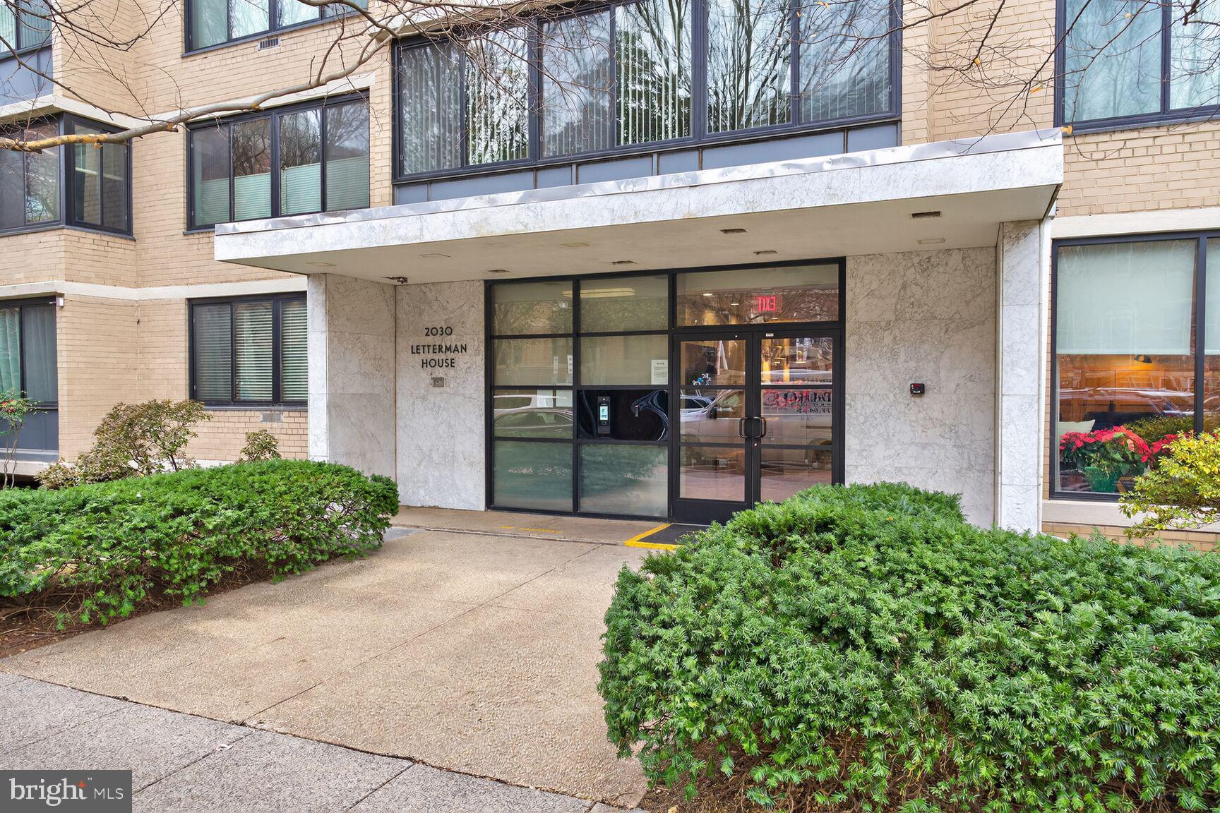 2030 F Street Northwest, Unit 411 Washington, DC 20006 - Photo 2 of 20 a front view of a house with garden