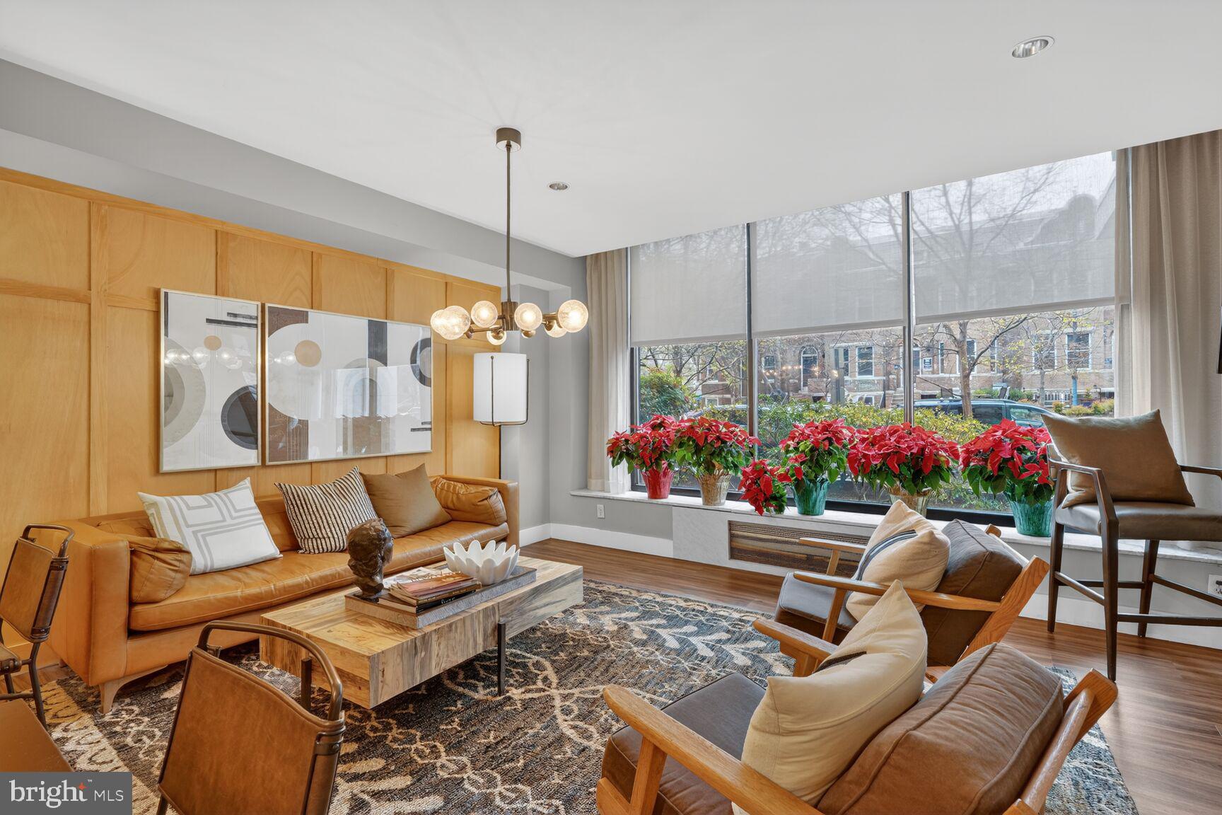 2030 F Street Northwest, Unit 411 Washington, DC 20006 - Photo 5 of 22 a living room with furniture and a chandelier