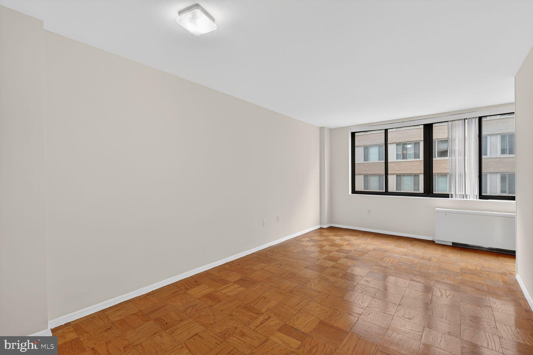 2030 F Street Northwest, Unit 411 Washington, DC 20006 - Photo 8 of 20 a view of an empty room with window
