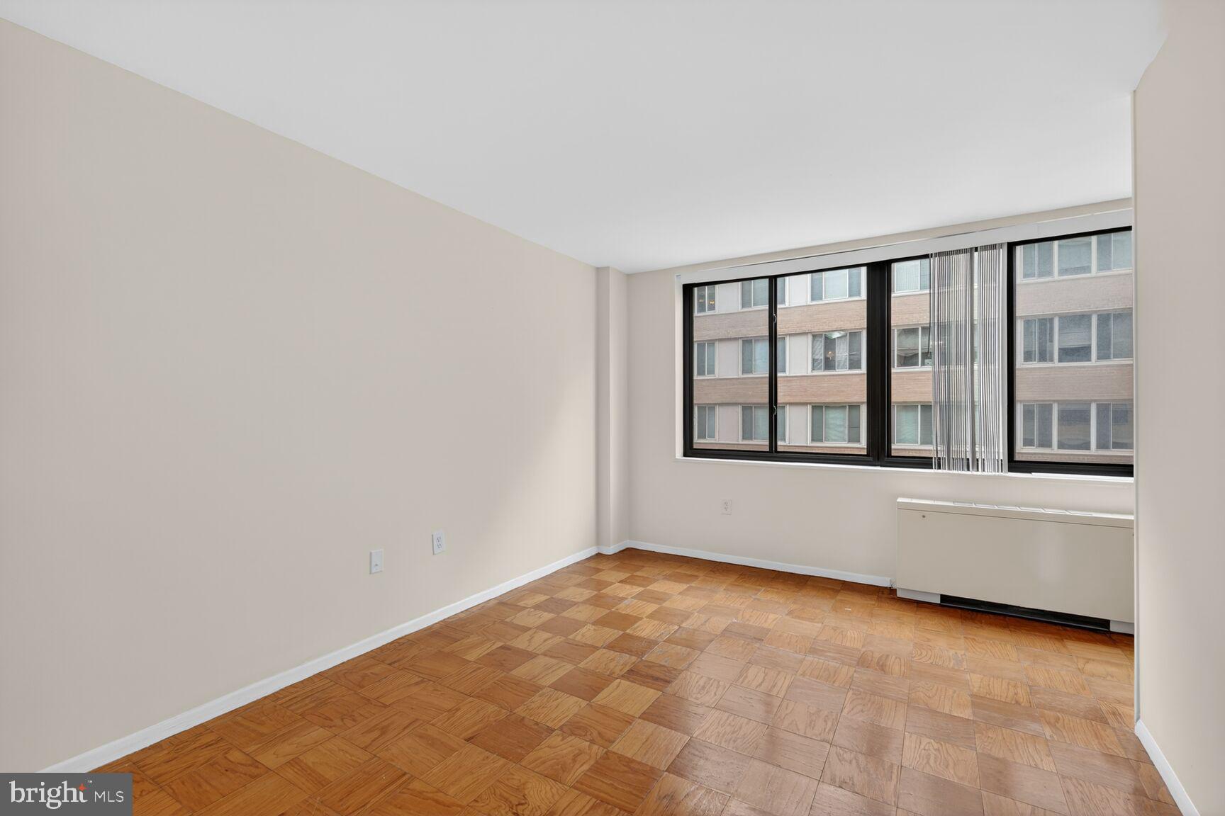 2030 F Street Northwest, Unit 411 Washington, DC 20006 - Photo 9 of 20 a view of an empty room with a window