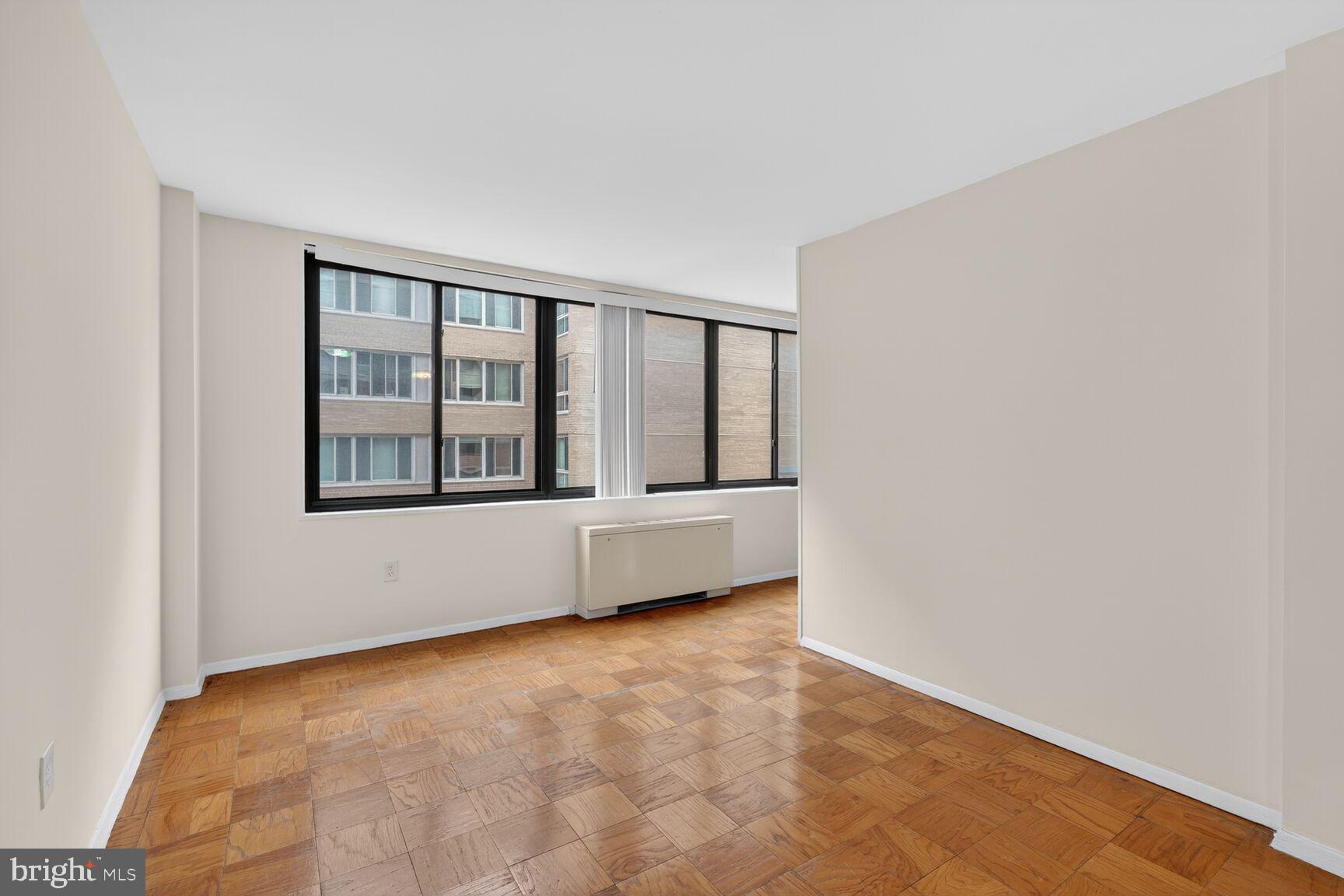2030 F Street Northwest, Unit 411 Washington, DC 20006 - Photo 10 of 20 a view of an empty room with window