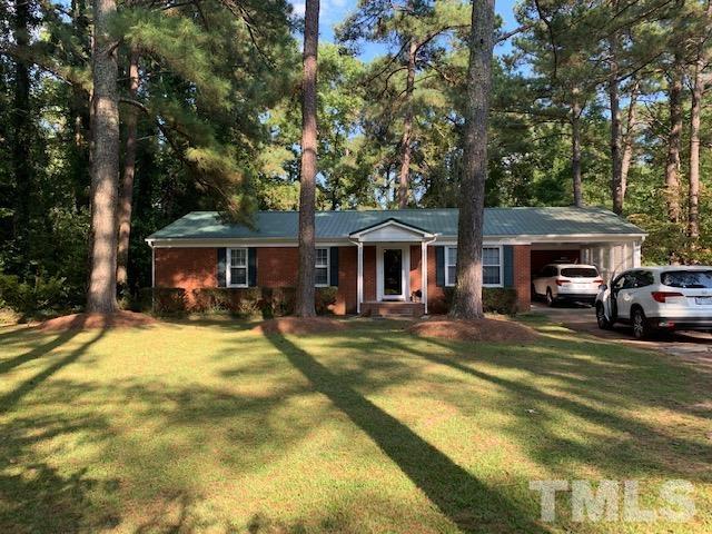 8329 Bells Lake Road Apex, NC 27539 - Photo 2 of 26 a view of house with outdoor space and swimming pool