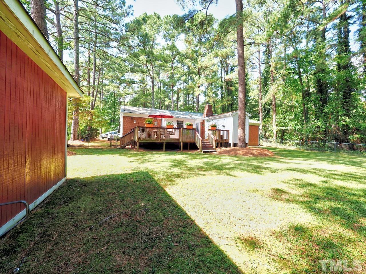 8329 Bells Lake Road Apex, NC 27539 - Photo 26 of 26 a view of a house with backyard and sitting area