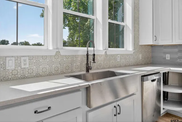 a kitchen with a sink and a window
