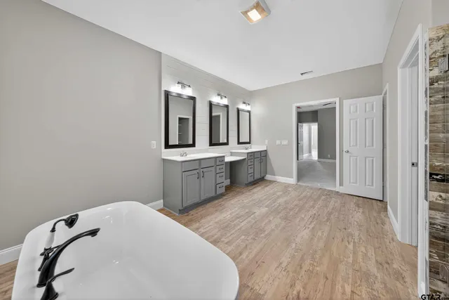 a bathroom with a sink and mirror