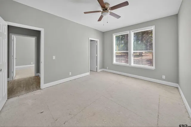 a view of an empty room with a window