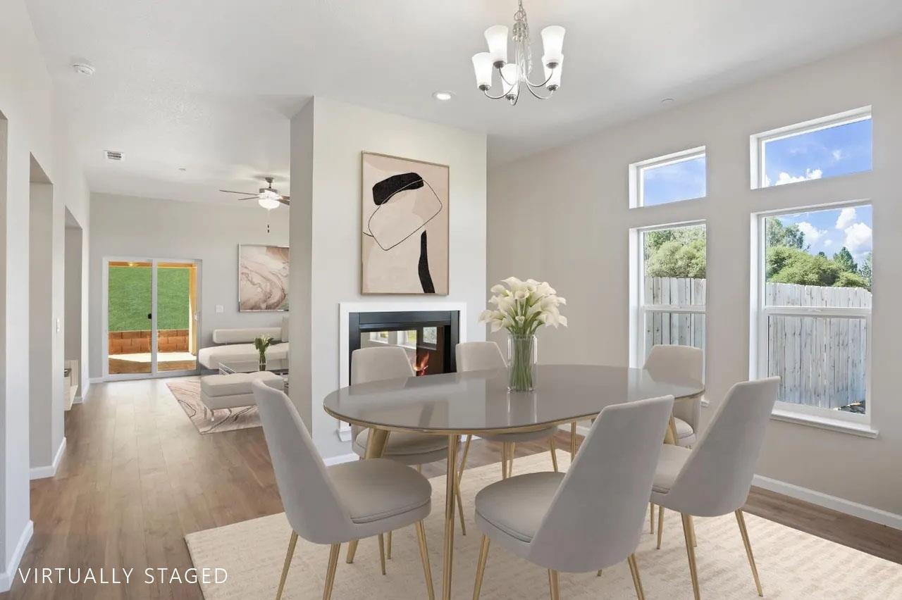 1811 Goldstone Avenue Jackson, CA 95642 - Photo 4 of 11 a view of a dining room with furniture a chandelier and wooden floor