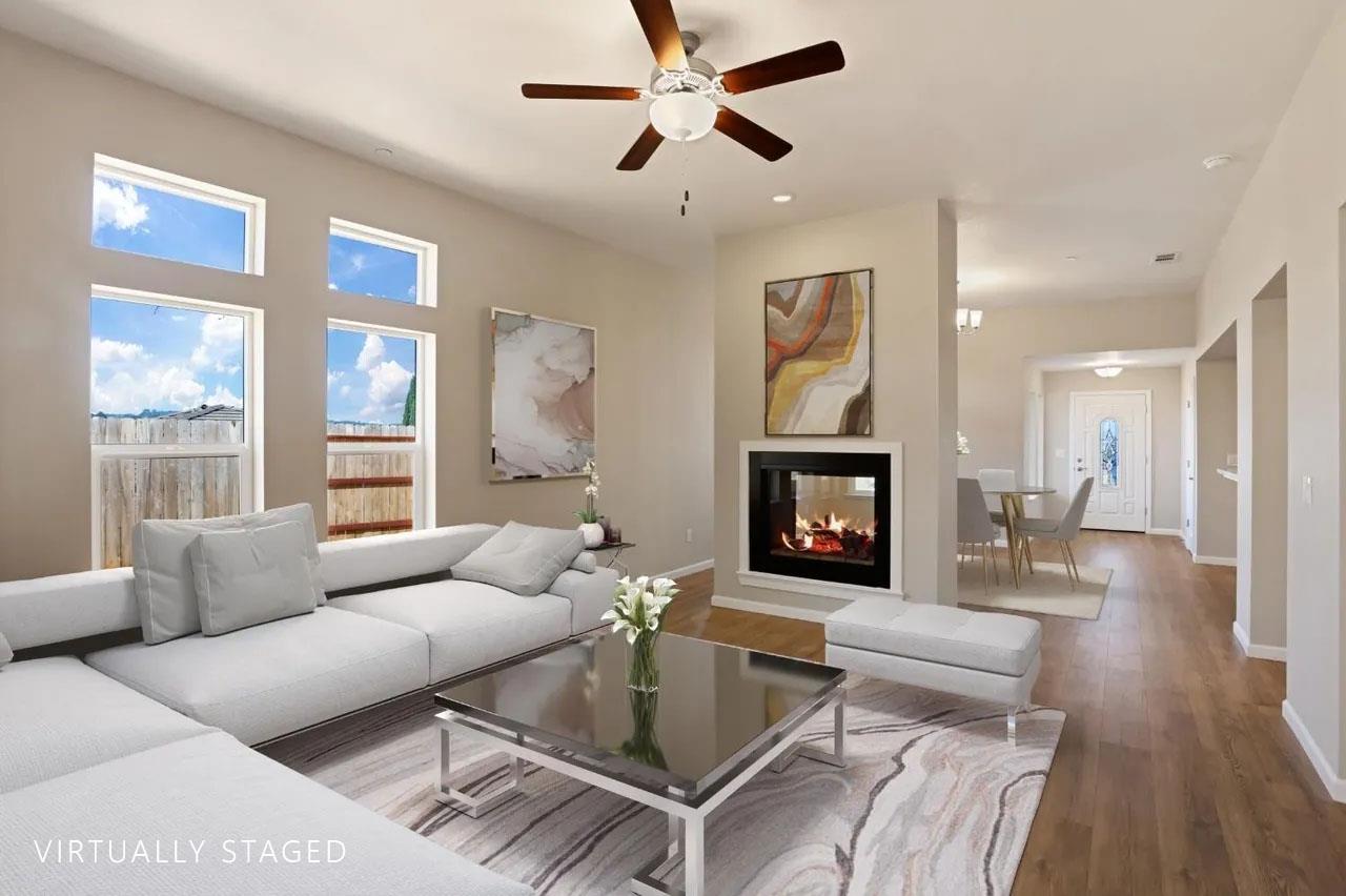 1811 Goldstone Avenue Jackson, CA 95642 - Photo 6 of 11 a living room with furniture a fireplace and a large window