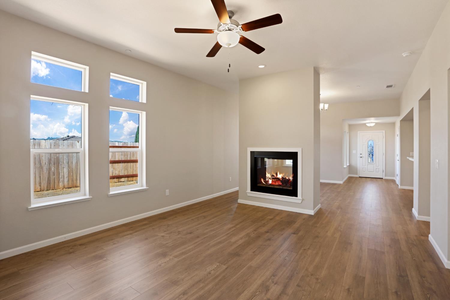 1811 Goldstone Avenue Jackson, CA 95642 - Photo 7 of 11 a view of an empty room with a window and wooden floor