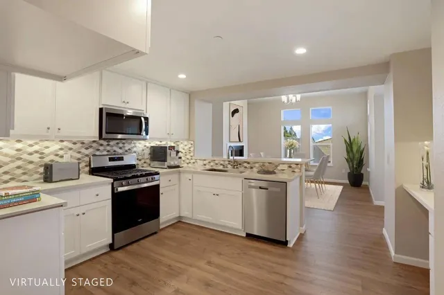 a kitchen with a sink stove and microwave