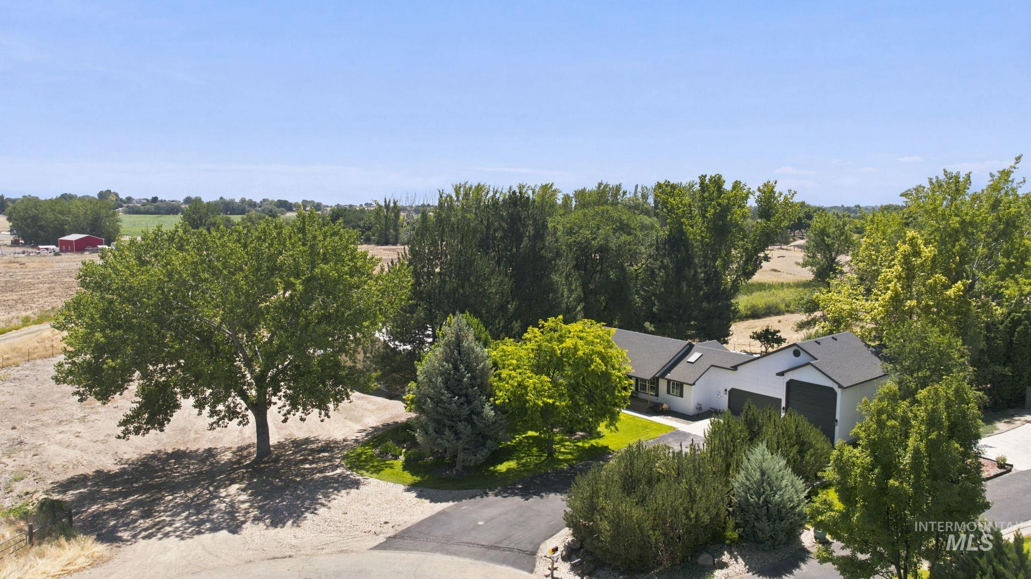 24864 Coventry Drive Caldwell, ID 83607 - Photo 1 of 49 Contemporary ranch-style residence featuring a white facade and dark trim