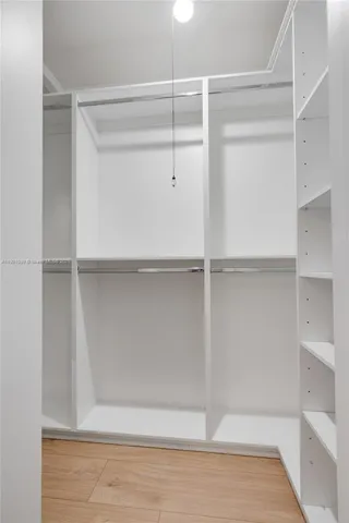 a view of an empty walk in closet