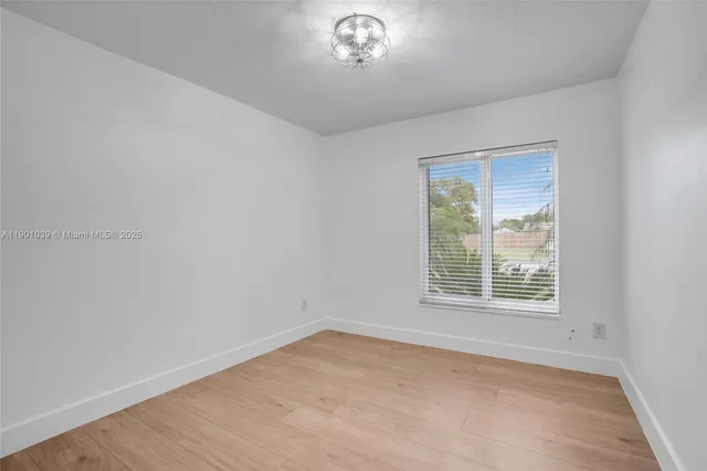 a view of a hallway with washer and dryer