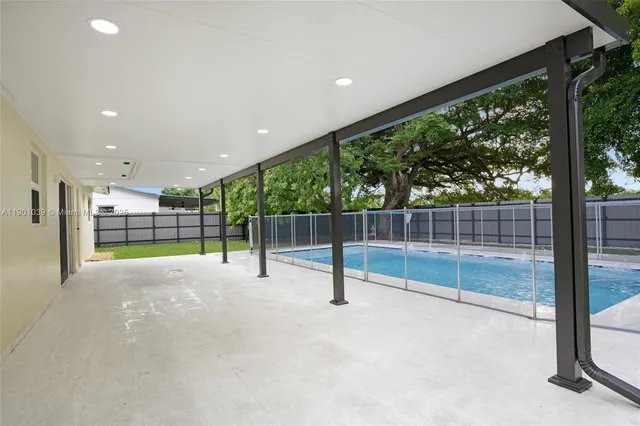 a view of a backyard with a small deck