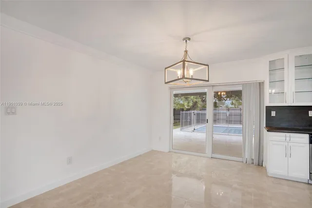 a kitchen with stainless steel appliances a refrigerator and a stove