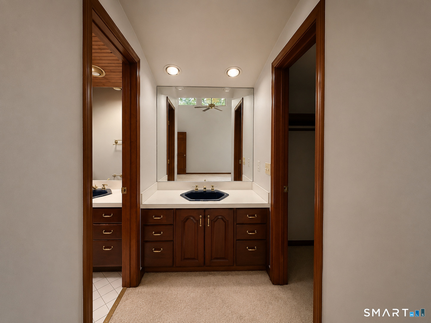 4 Ta'Agan Point Road Danbury, CT 06811 - Photo 14 of 22 a bathroom with a double vanity sink and a mirror